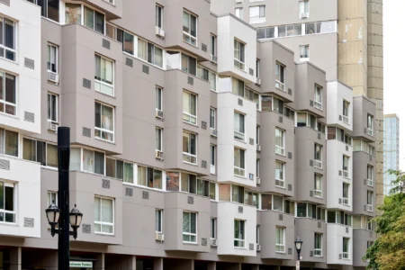 Angled view of The Landings apartment facade with projecting windows and balconies.